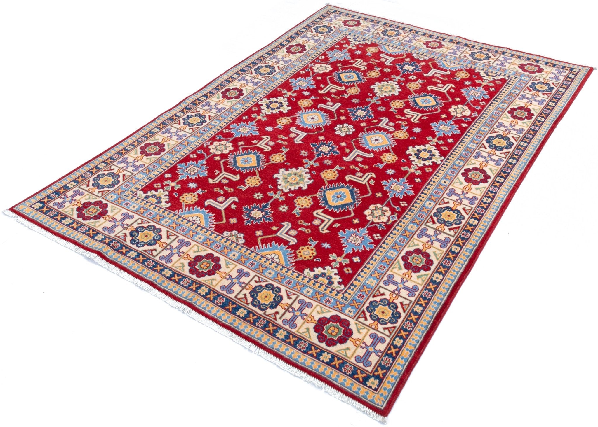 Full view at an angle of red & blue Kazak-inspired wool rug 21542.