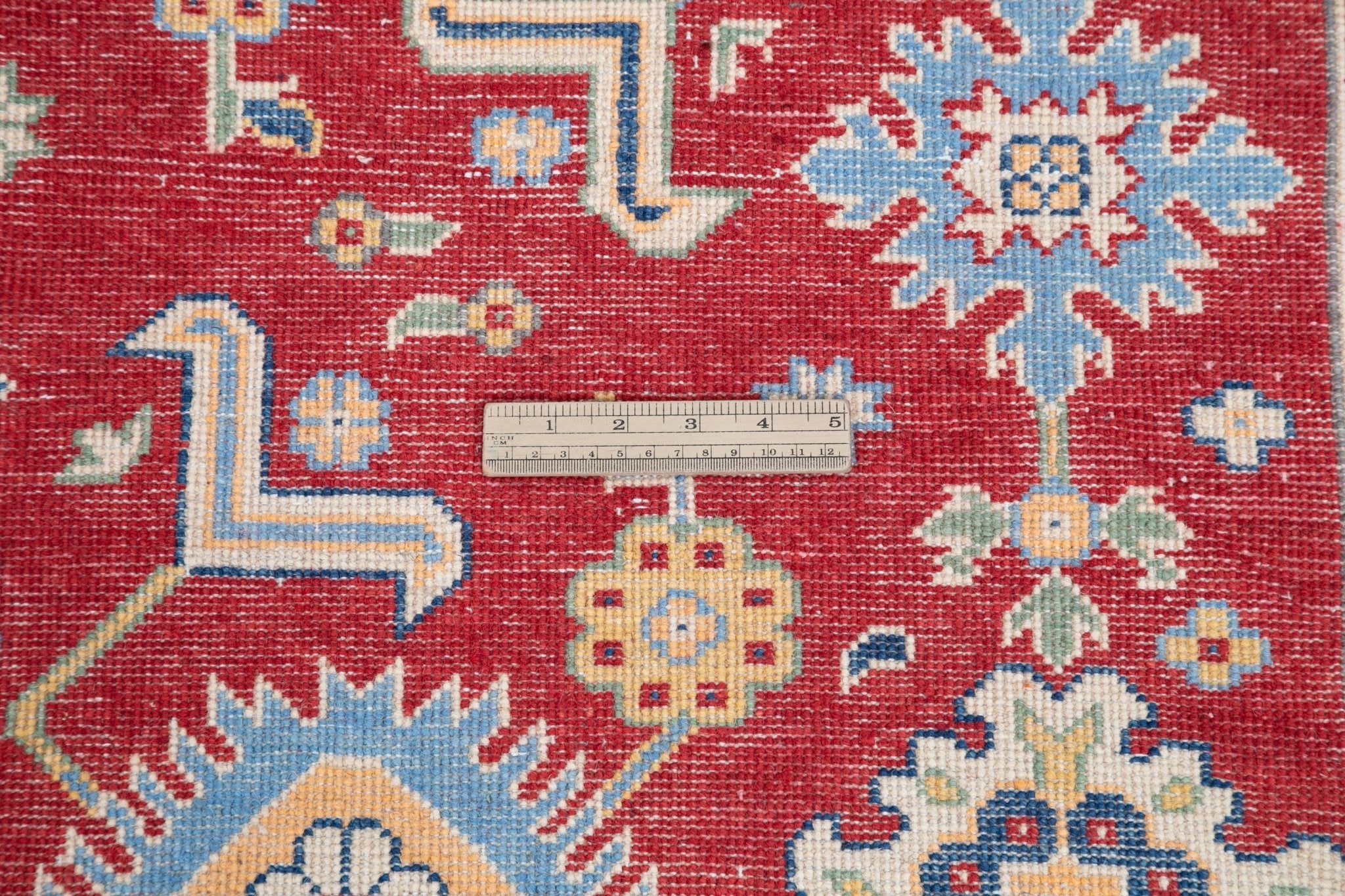 Wool pile close-up of red & blue Kazak-inspired wool rug 21542.