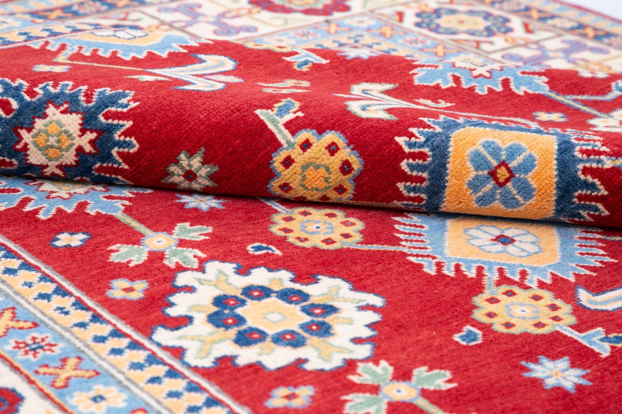 Pattern detail of red & blue Kazak-inspired wool rug 21542.
