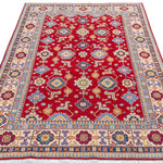 Full view from a low angle of red & blue Kazak-inspired wool rug 21542.