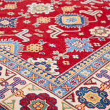 Folded edge and wool pile of red & blue Kazak-inspired wool rug 21542.
