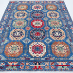 Full view from a low angle of blue & red Kazak-inspired wool rug 29635.