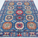 Full view from a low angle of blue & red Kazak-inspired wool rug 29635.