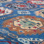 Pattern detail of blue & red Kazak-inspired wool rug 29635.