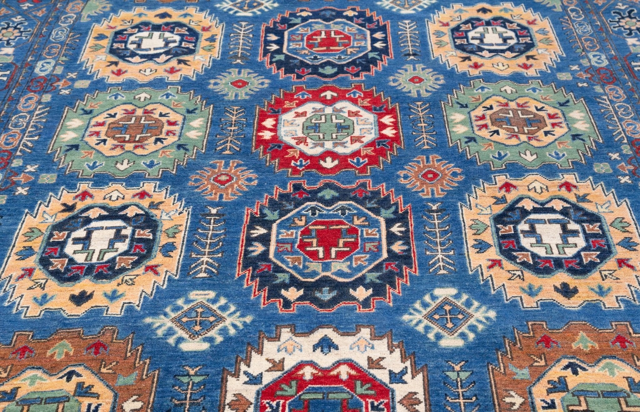 Pattern detail of blue & red Kazak-inspired wool rug 29635.
