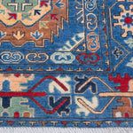 Border and edge detail of blue & red Kazak-inspired wool rug 29635.