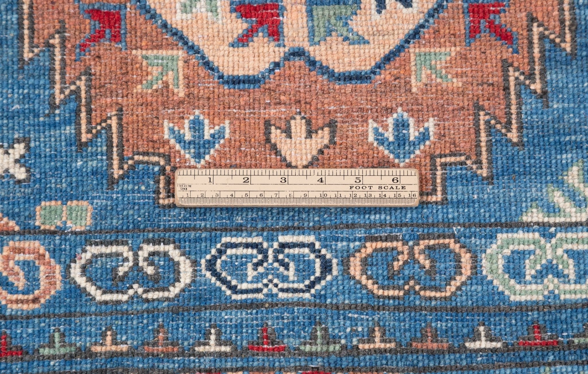 Wool pile close-up of blue & red Kazak-inspired wool rug 29635.