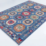 Full view at an angle of blue & red Kazak-inspired wool rug 29635.