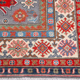 Border and edge detail of blue & red Kazak-inspired wool rug 29345.