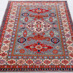 Full view from a low angle of blue & red Kazak-inspired wool rug 29345.