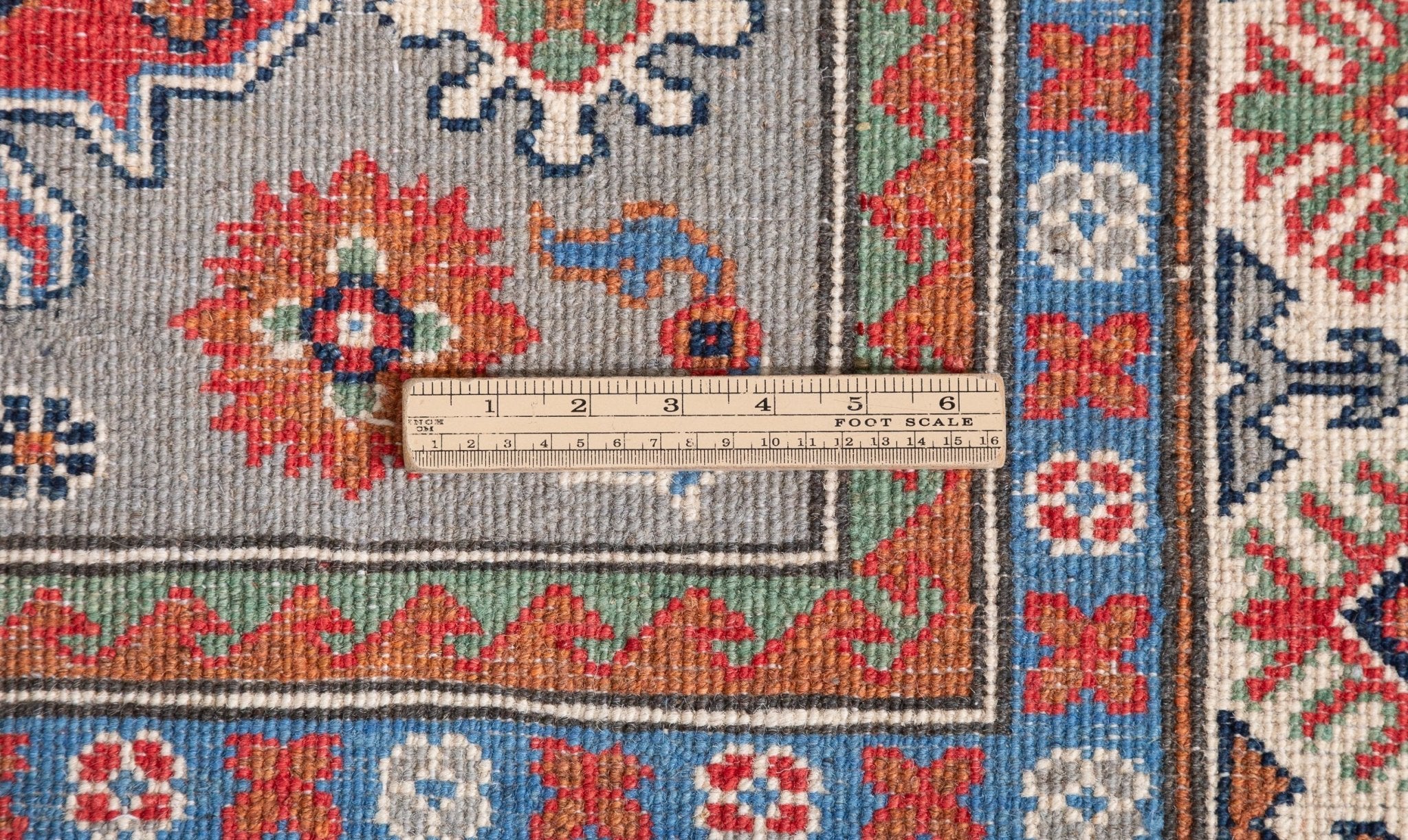 Wool pile close-up of blue & red Kazak-inspired wool rug 29345.