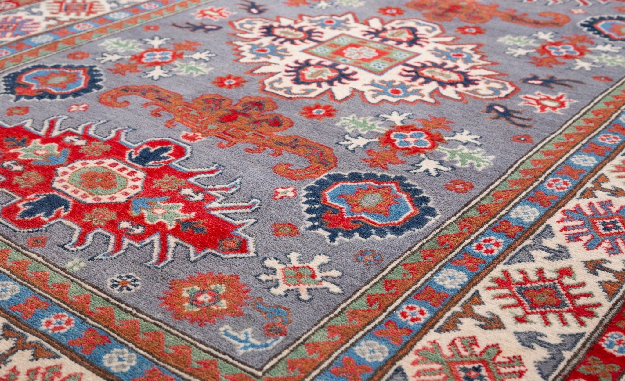 Pattern detail of blue & red Kazak-inspired wool rug 29345.