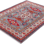 Full view at an angle of blue & red Kazak-inspired wool rug 29345.