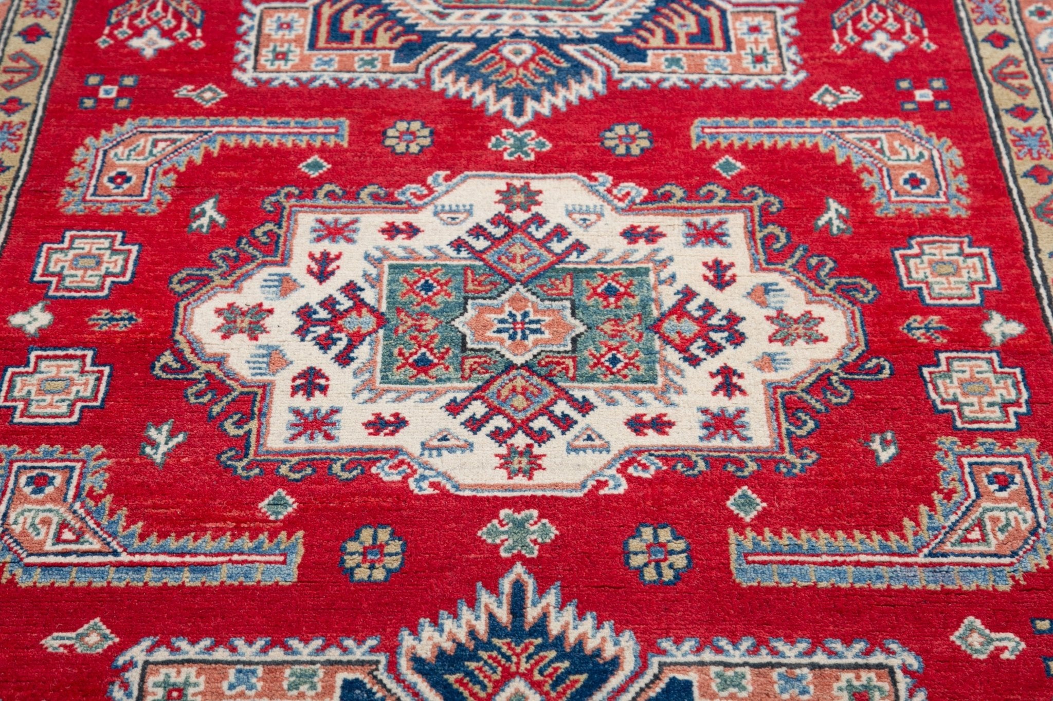 Pattern detail of red & blue Kazak-inspired wool rug 21613.