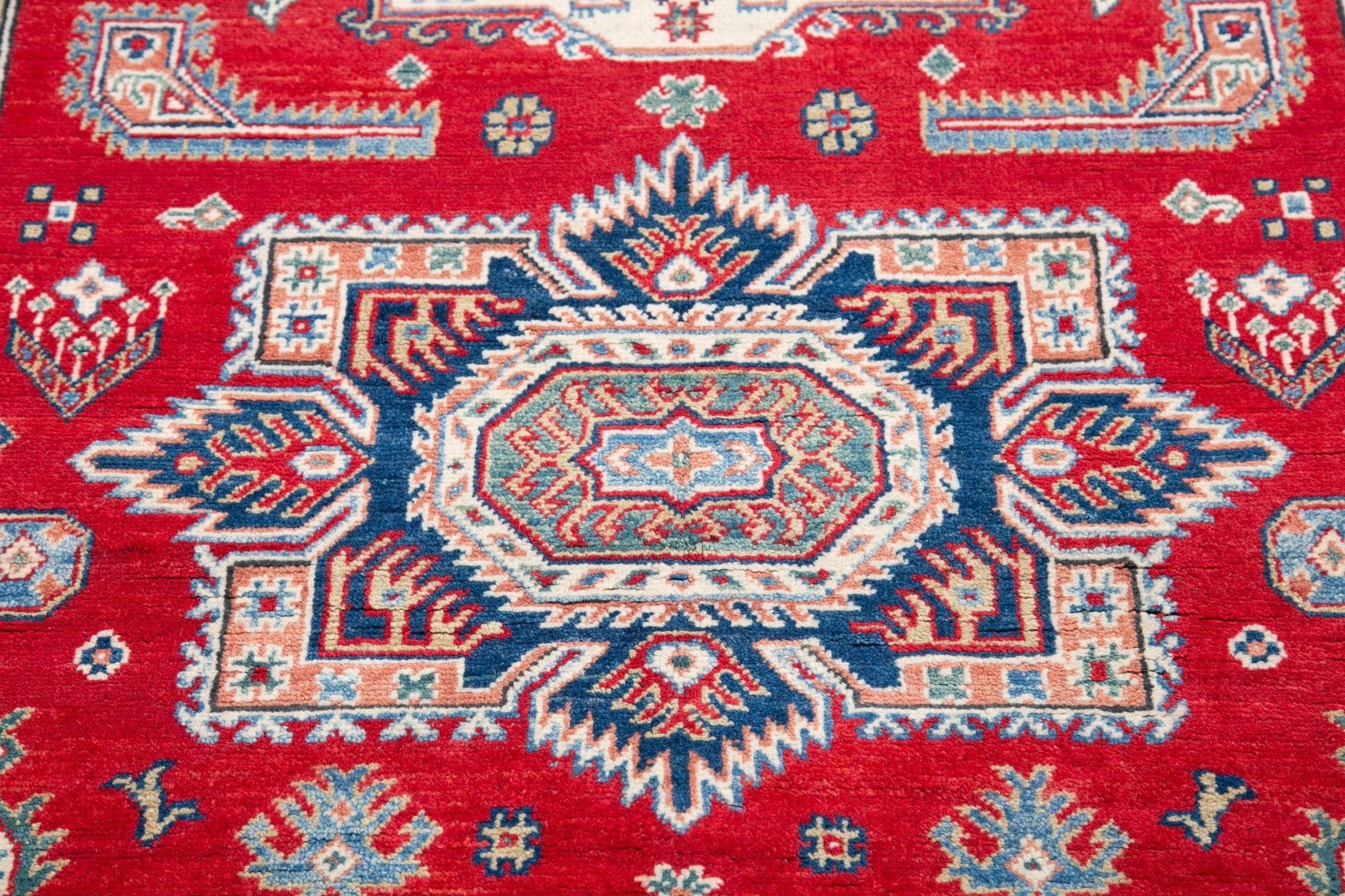 Pattern detail of red & blue Kazak-inspired wool rug 21613.