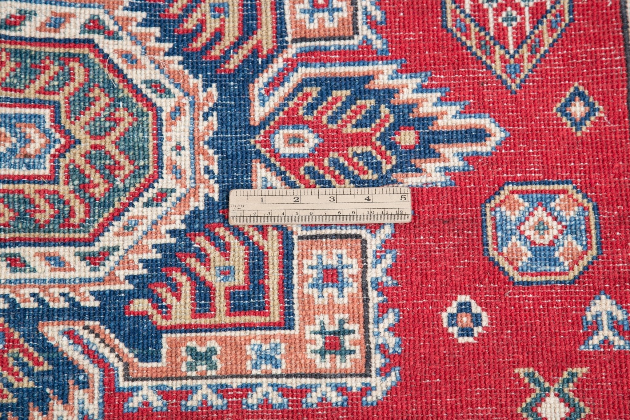 Wool pile close-up of red & blue Kazak-inspired wool rug 21613.