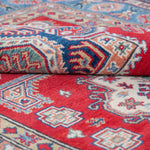 Folded edge and wool pile of red & blue Kazak-inspired wool rug 21613.