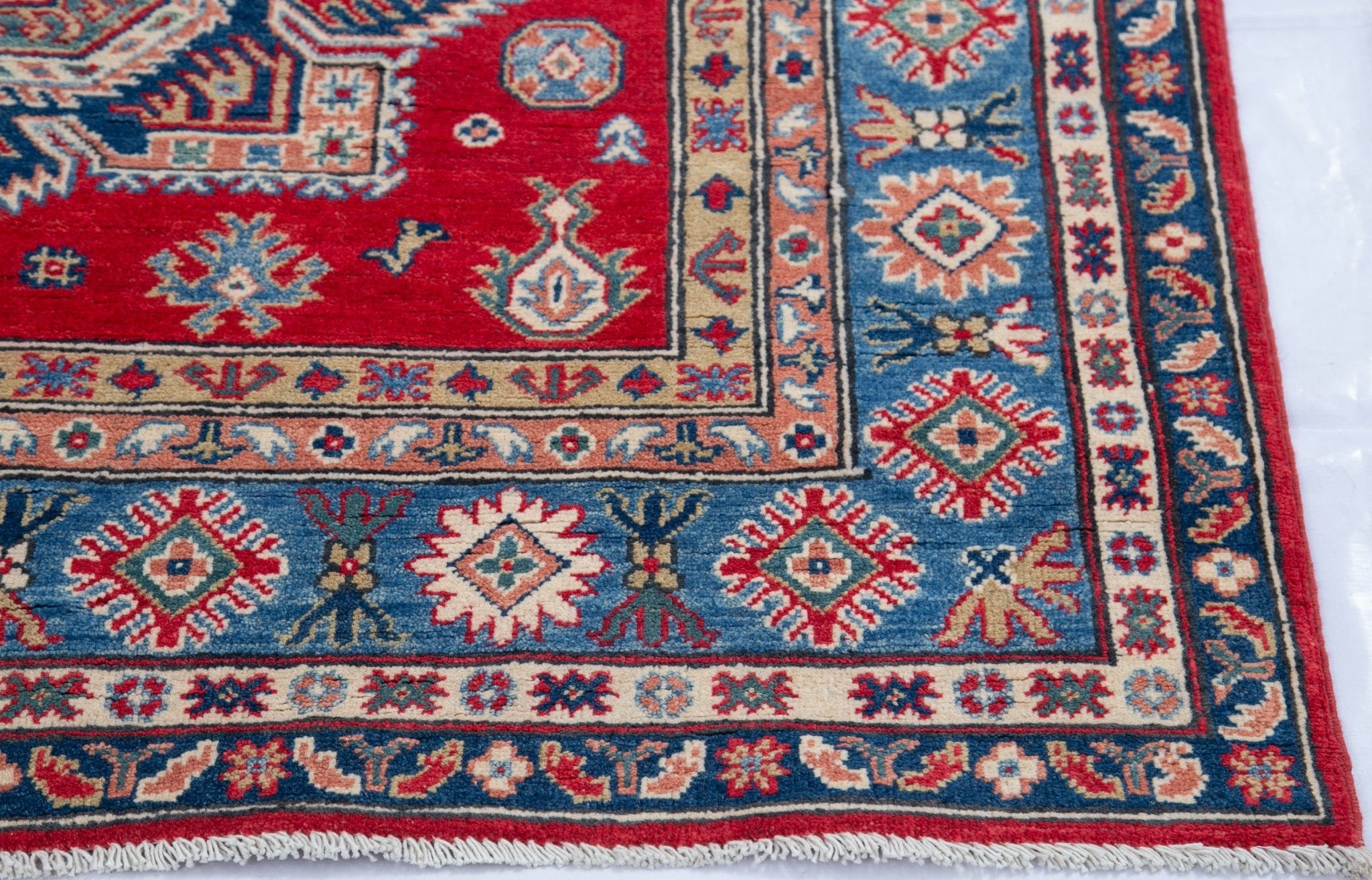 Border and edge detail of red & blue Kazak-inspired wool rug 21613.