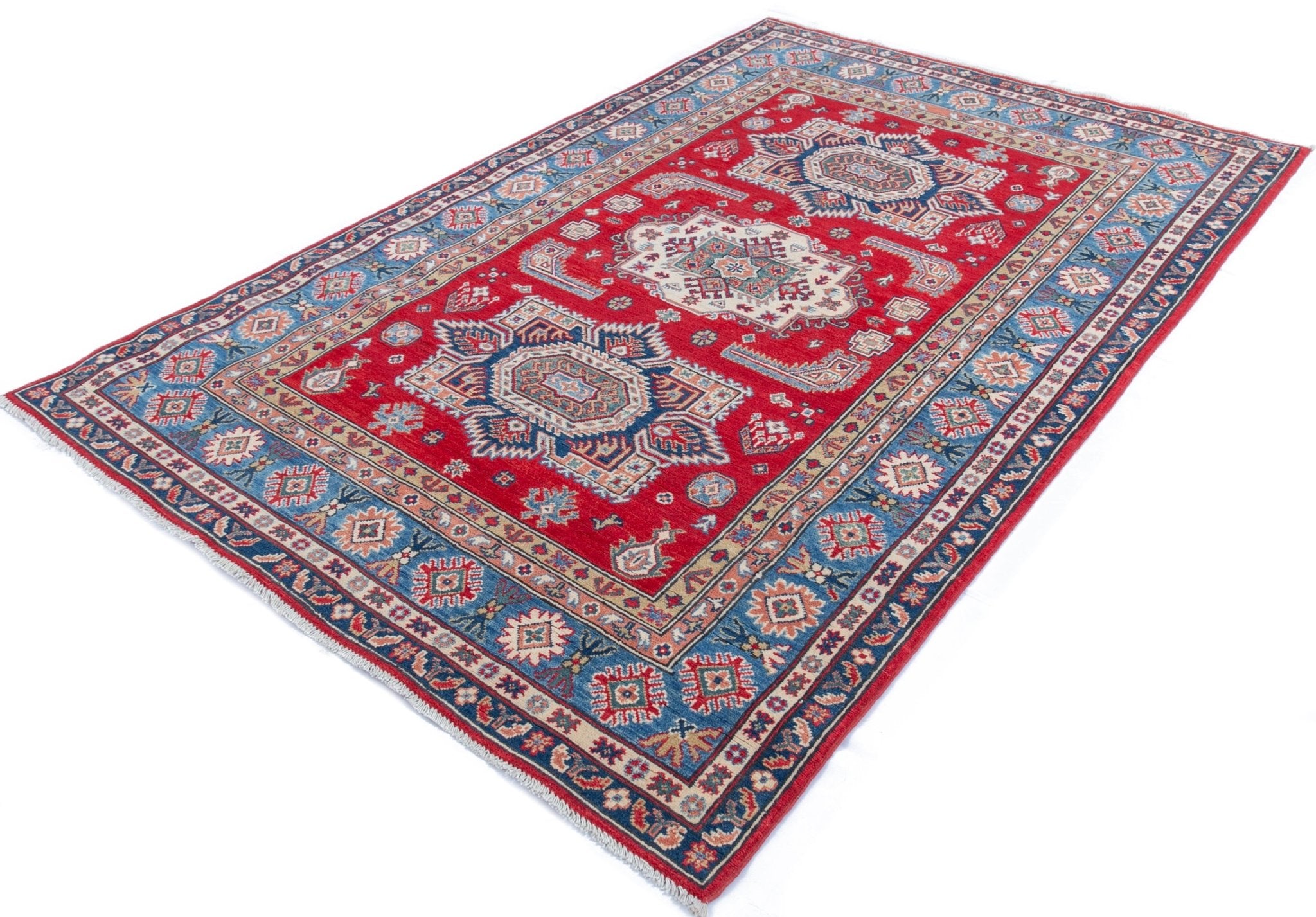 Full view at an angle of red & blue Kazak-inspired wool rug 21613.