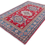 Full view at an angle of red & blue Kazak-inspired wool rug 21613.