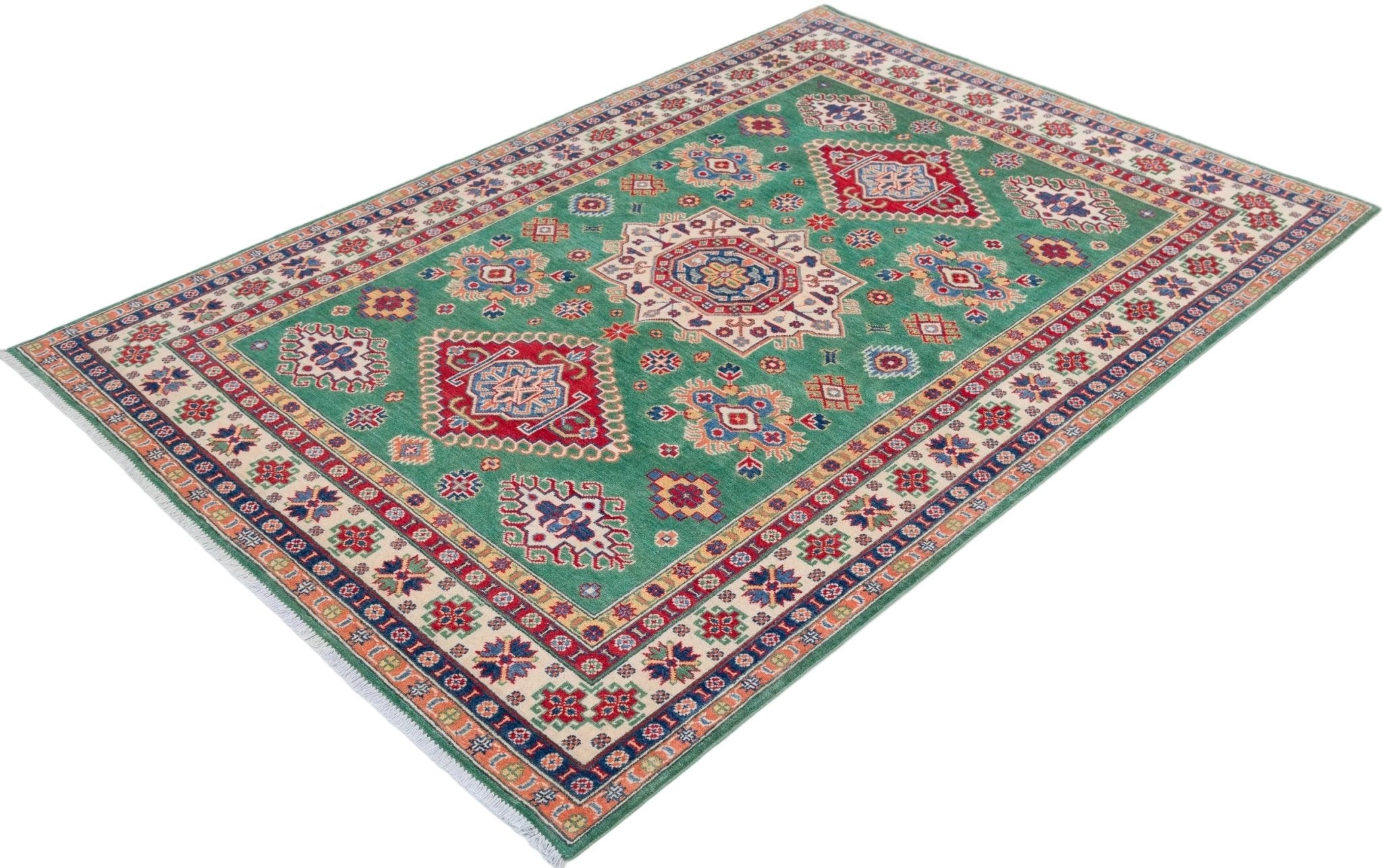 Full view at an angle of green & red Kazak-inspired wool rug 29638.