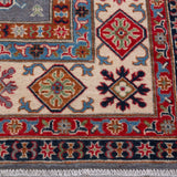 Border and edge detail of blue & red Kazak-inspired wool rug 29339.