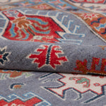 Folded edge and wool pile of blue & red Kazak-inspired wool rug 29339.