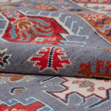 Folded edge and wool pile of blue & red Kazak-inspired wool rug 29339.