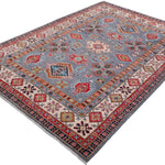 Full view at an angle of blue & red Kazak-inspired wool rug 29339.