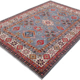 Full view at an angle of blue & red Kazak-inspired wool rug 29339.