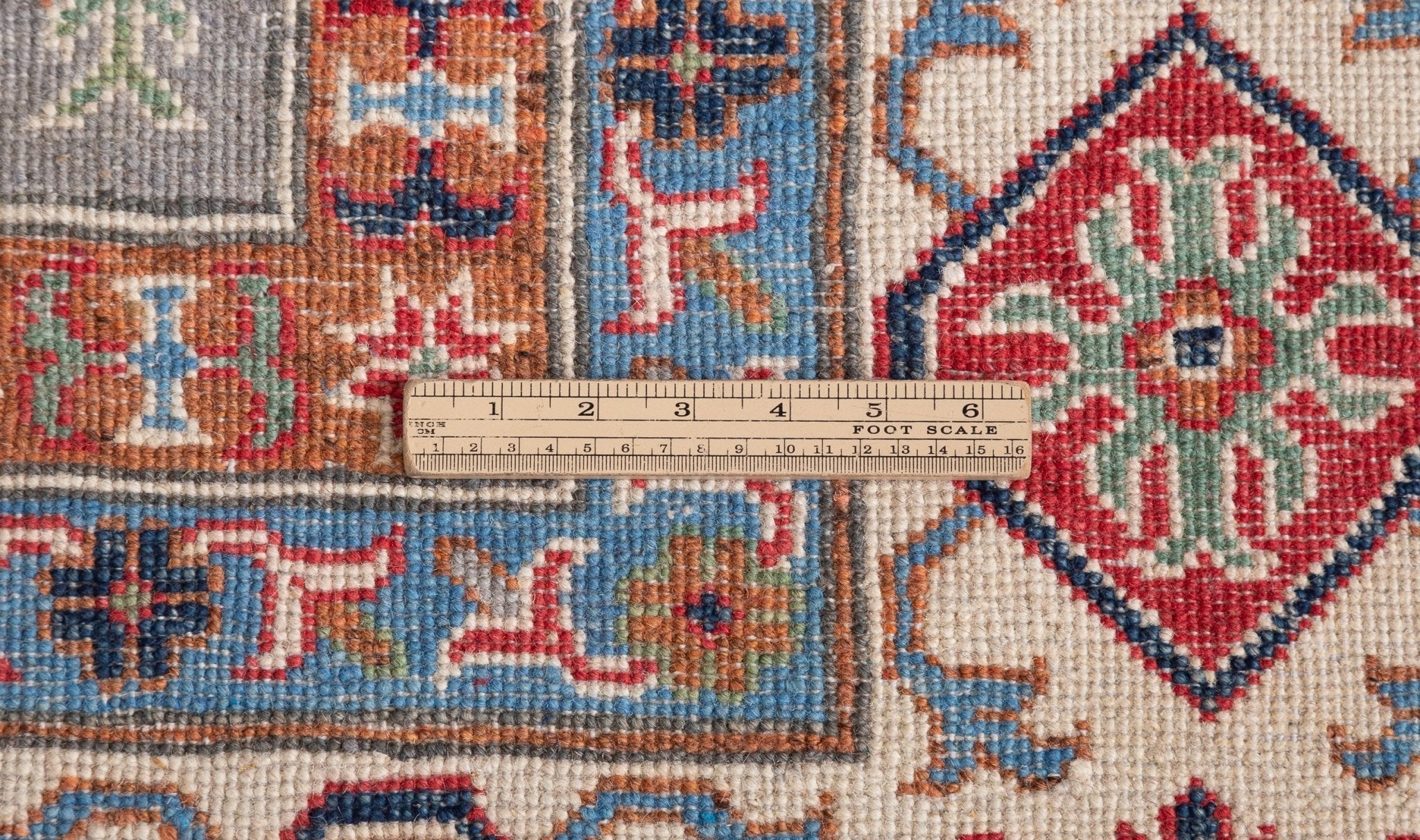 Wool pile close-up of blue & red Kazak-inspired wool rug 29339.
