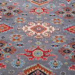 Pattern detail of blue & red Kazak-inspired wool rug 29339.