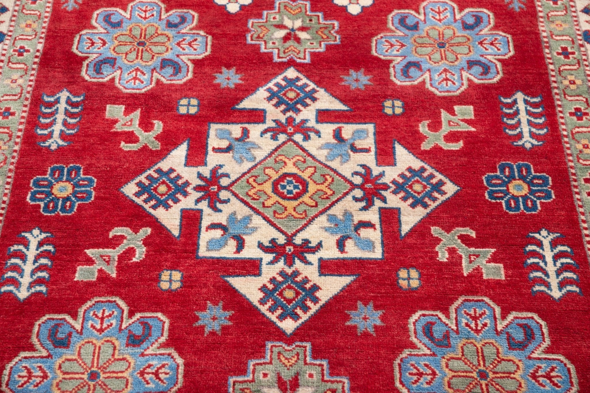 Pattern detail of red & ivory Kazak-inspired wool rug 21991.