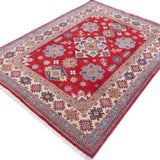 Full view at an angle of red & ivory Kazak-inspired wool rug 21991.