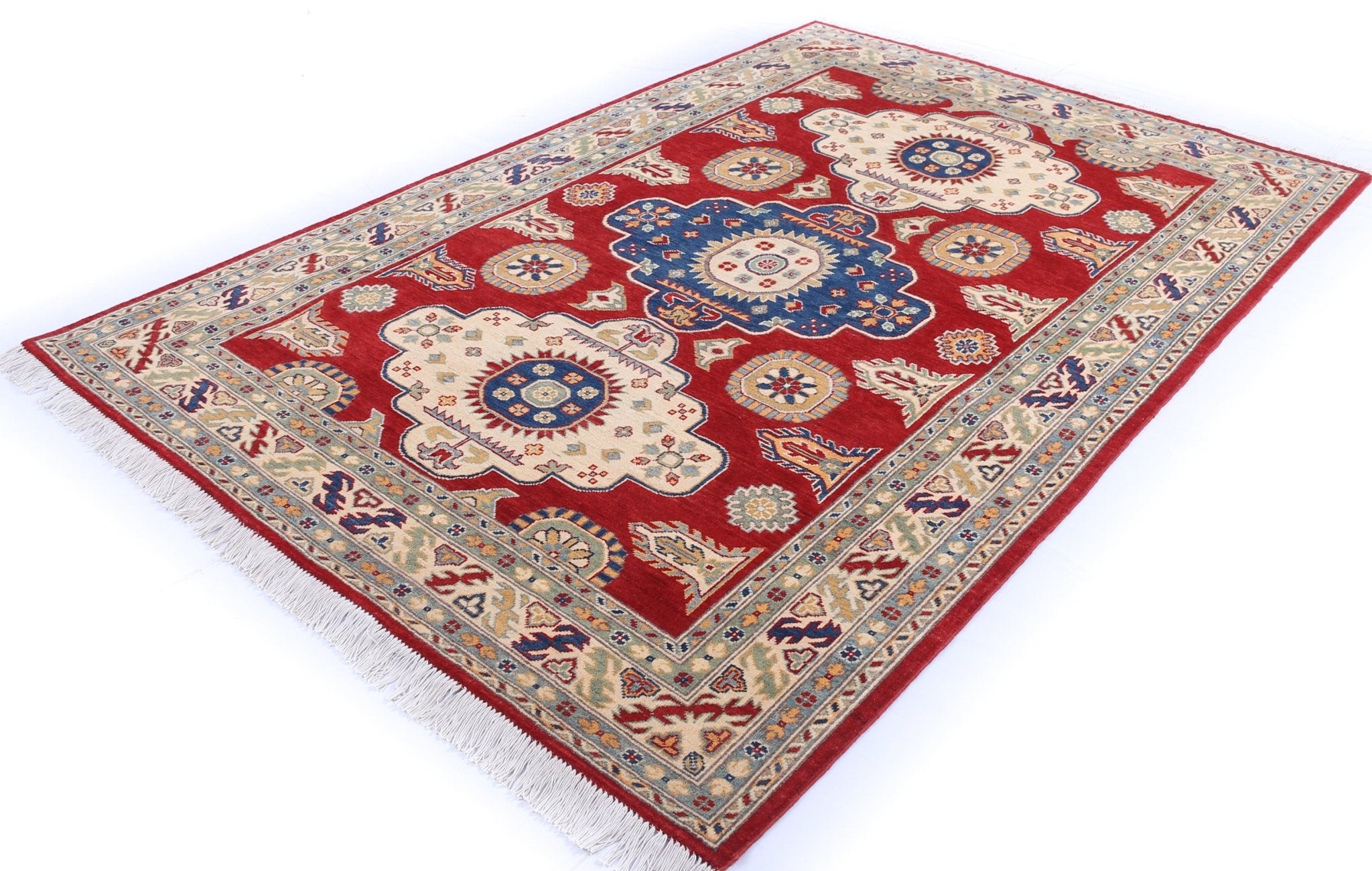 Full view at an angle of red & ivory Kazak-inspired wool rug 22082.