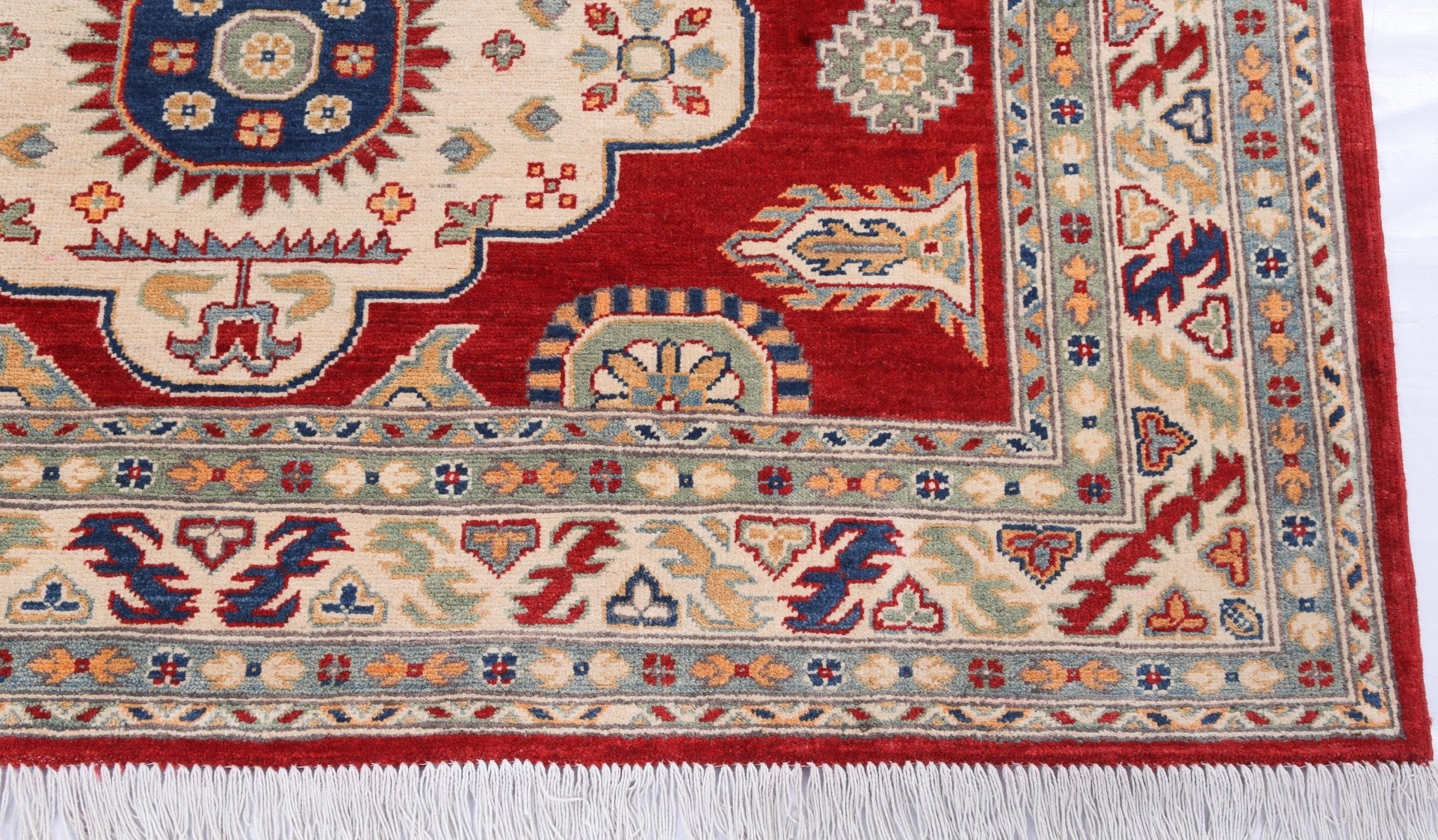 Border and edge detail of red & ivory Kazak-inspired wool rug 22082.