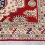 Border and edge detail of red & ivory Kazak-inspired wool rug 22082.
