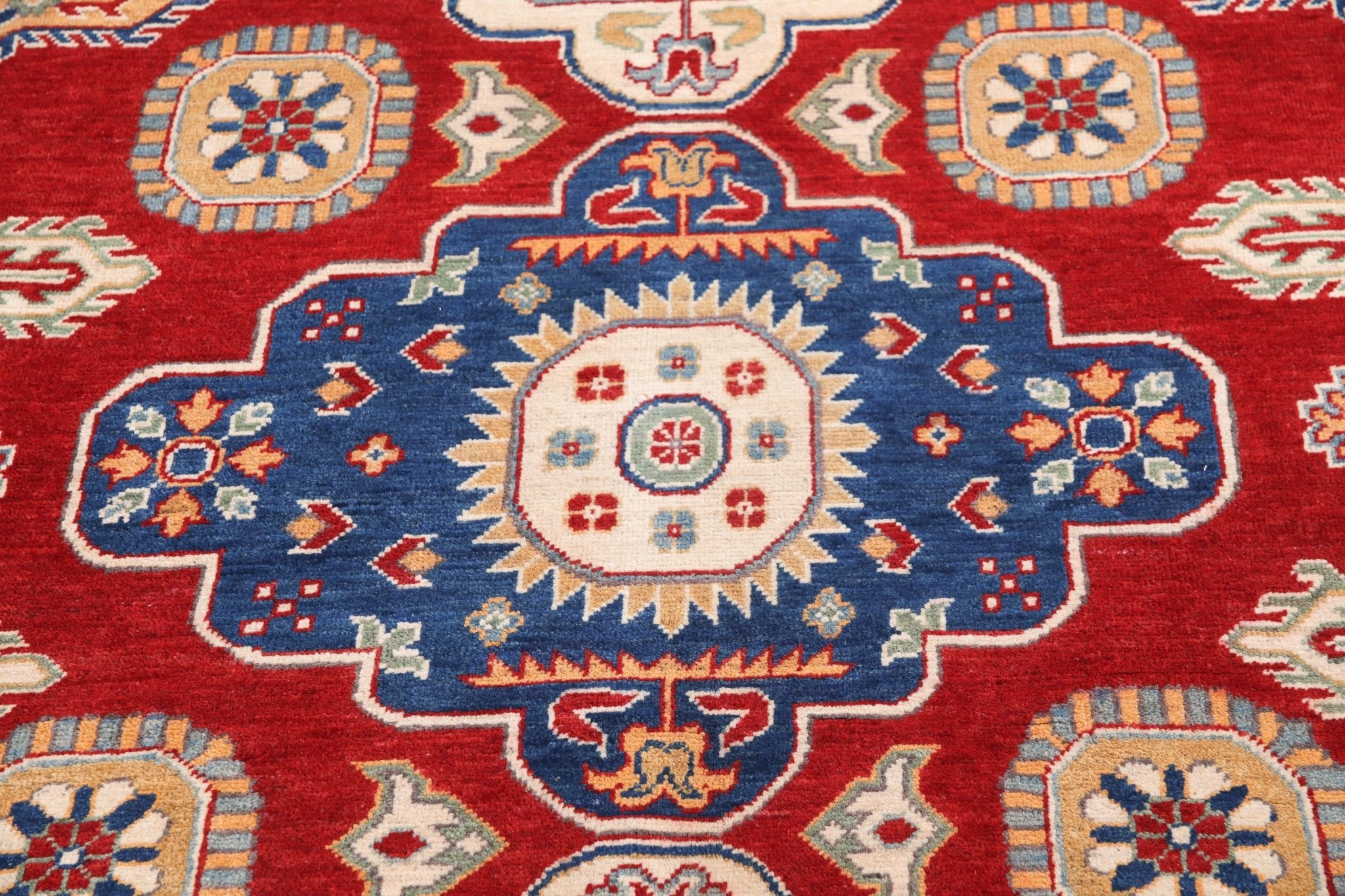 Pattern detail of red & ivory Kazak-inspired wool rug 22082.