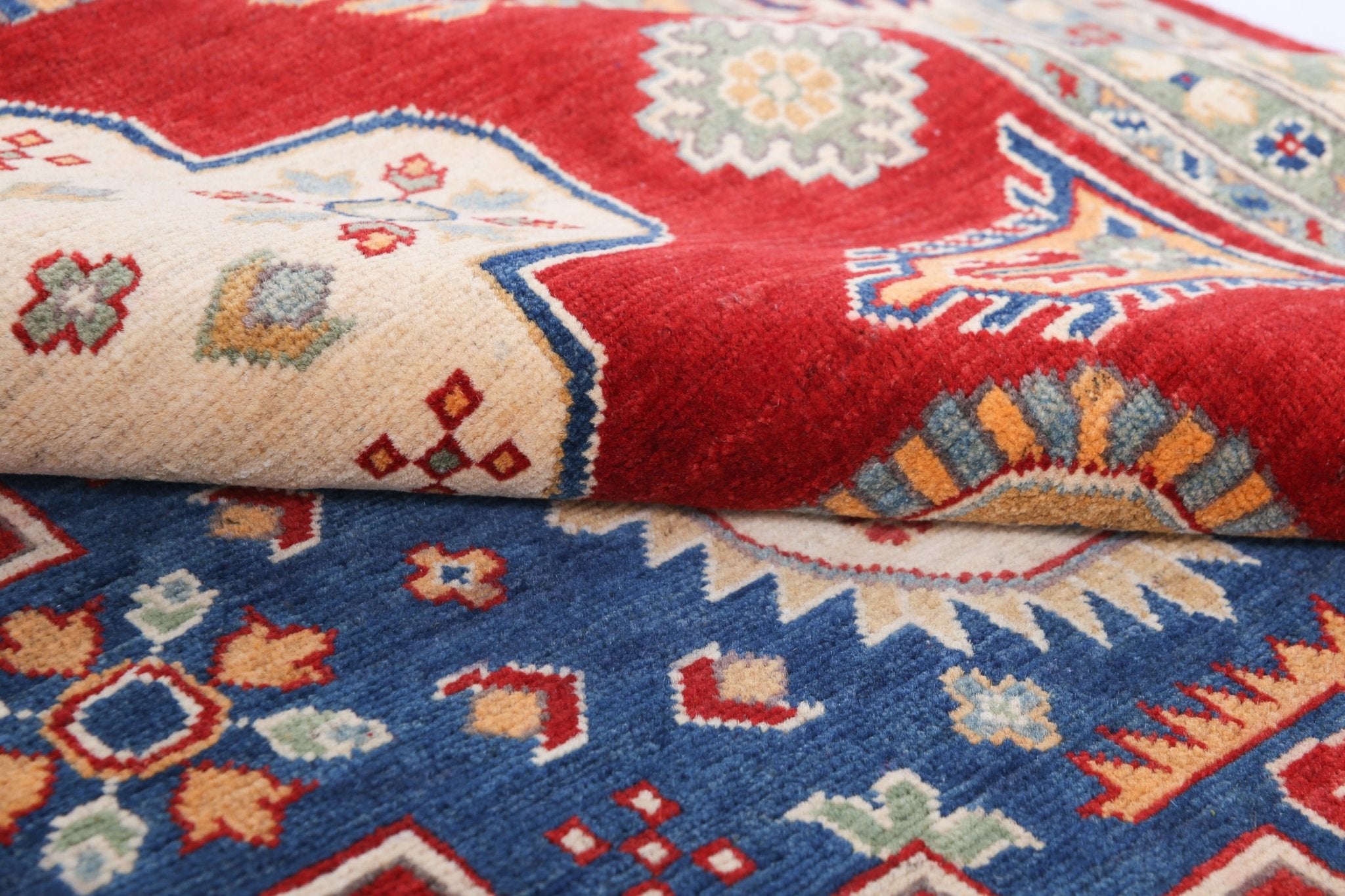 Wool pile close-up of red & ivory Kazak-inspired wool rug 22082.