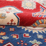 Wool pile close-up of red & ivory Kazak-inspired wool rug 22082.