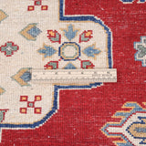 Folded edge and wool pile of red & ivory Kazak-inspired wool rug 22082.