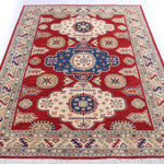 Full view from a low angle of red & ivory Kazak-inspired wool rug 22082.