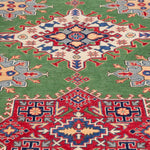 Pattern detail of green & red Kazak-inspired wool rug 29641.
