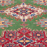 Pattern detail of green & red Kazak-inspired wool rug 29641.