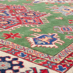 Pattern detail of green & red Kazak-inspired wool rug 29641.