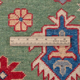 Wool pile close-up of green & red Kazak-inspired wool rug 29641.