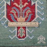 Wool pile close-up of green & ivory Kazak-inspired wool rug 29640.