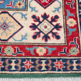 Border and edge detail of green & ivory Kazak-inspired wool rug 29640.
