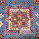 Pattern detail of blue & red Kazak-inspired wool rug 24986.
