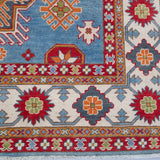 Border and edge detail of blue & red Kazak-inspired wool rug 24986.